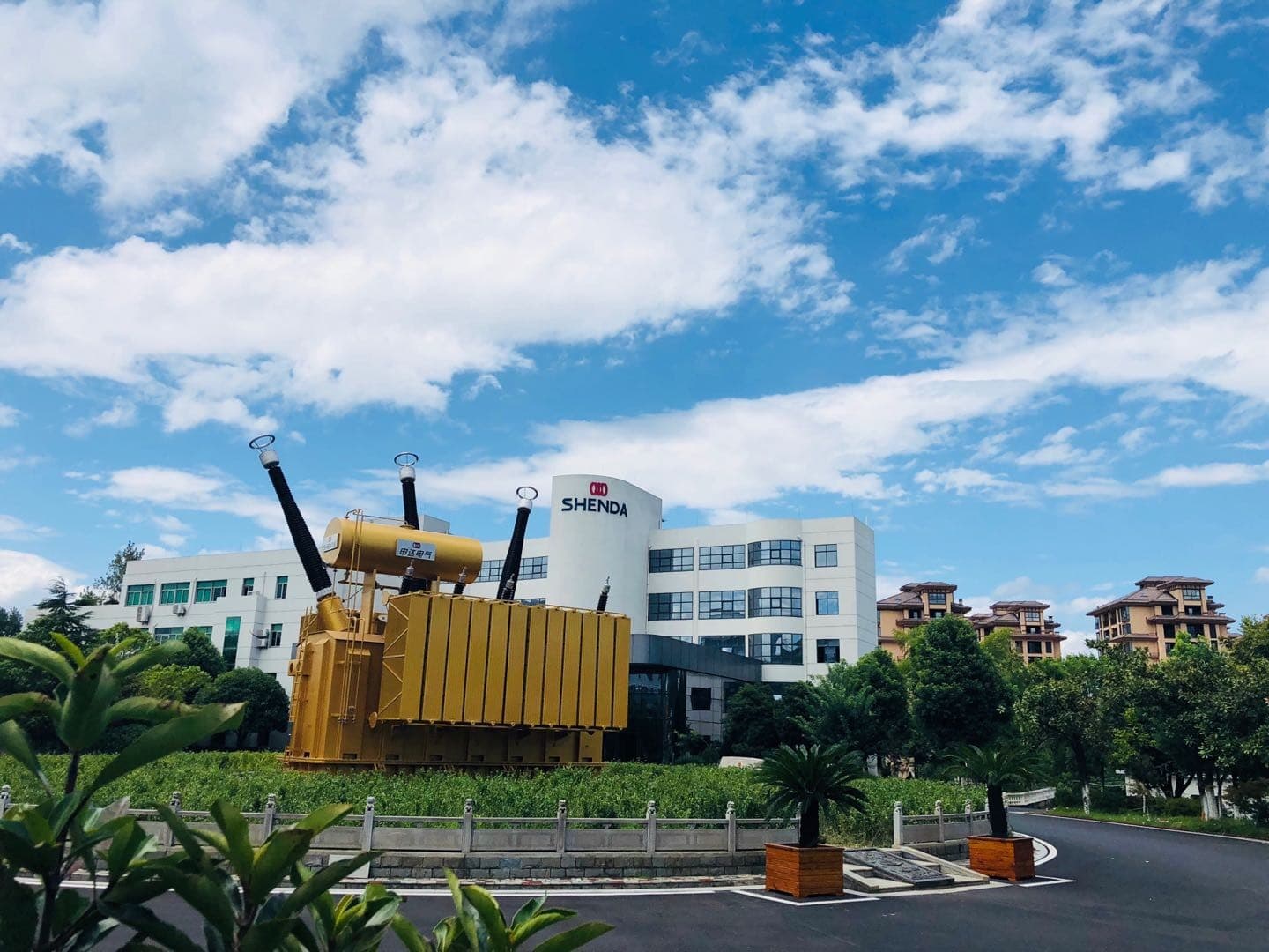 Shenda Electric headquarters, with a power transformer displayed at the entrance
